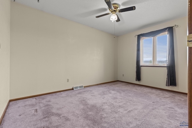 2506 Junction Dr, Rapid City, SD 57702 - carpeted empty room with a textured ceiling, baseboards, ceiling fan, and visible vents