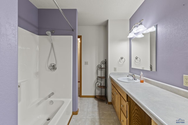 2506 Junction Dr, Rapid City, SD 57702 - full bath featuring vanity, bathing tub / shower combination, a textured ceiling, tile patterned flooring, and baseboards