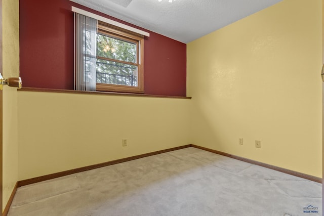 2506 Junction Dr, Rapid City, SD 57702 - carpeted empty room featuring baseboards and a textured ceiling