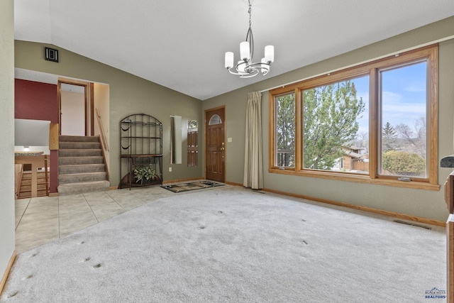 2506 Junction Dr, Rapid City, SD 57702 - interior space with stairs, vaulted ceiling, visible vents, carpet, and an inviting chandelier