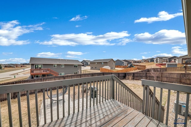 4400 Beringer Dr, Rapid City, SD 57703 - wooden terrace with a fenced backyard and a residential view