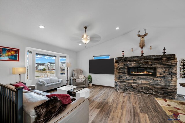 4400 Beringer Dr, Rapid City, SD 57703 - living room with ceiling fan, wood finished floors, recessed lighting, a stone fireplace, and vaulted ceiling