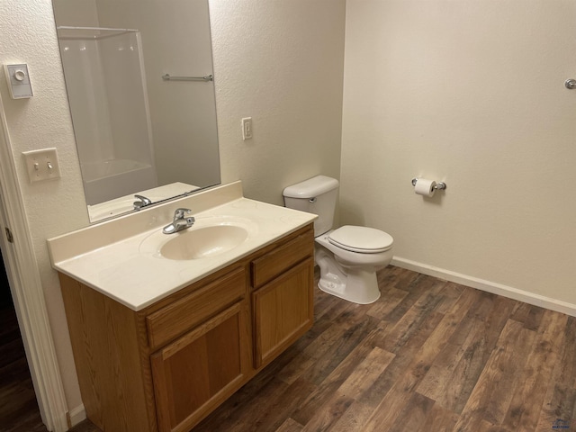 1111 Silver St, Rapid City, SD 57701 - bathroom featuring vanity, toilet, baseboards, walk in shower, and wood finished floors