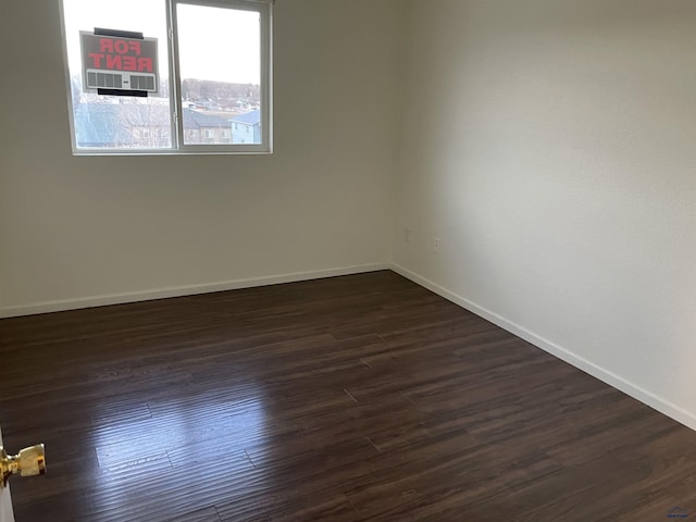 1111 Silver St, Rapid City, SD 57701 - empty room with baseboards and dark wood finished floors