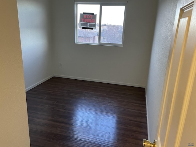 1111 Silver St, Rapid City, SD 57701 - empty room with dark wood-style flooring and baseboards