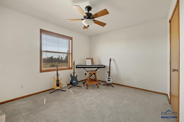 miscellaneous room with baseboards, visible vents, carpet floors, and a ceiling fan