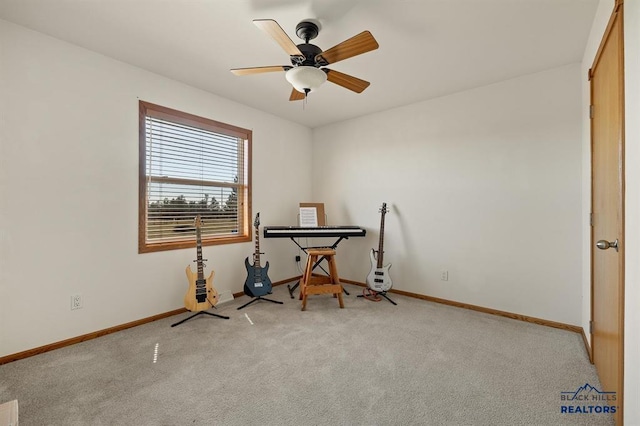 miscellaneous room with carpet flooring, a ceiling fan, baseboards, and visible vents