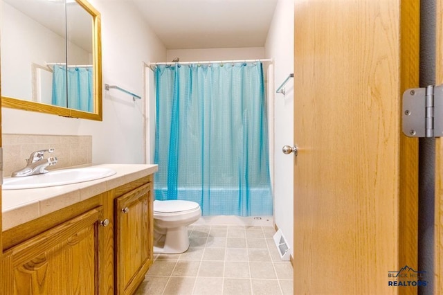 full bath featuring toilet, vanity, tasteful backsplash, tile patterned flooring, and visible vents