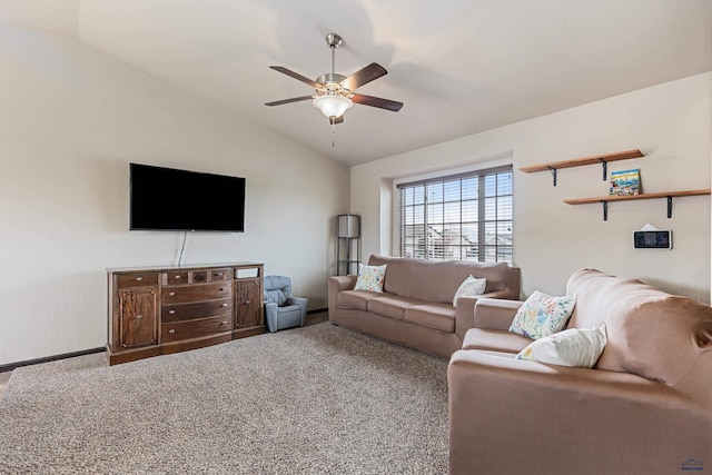 living area featuring carpet flooring, a ceiling fan, and lofted ceiling