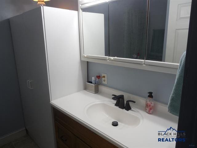 23508 Main St, Caputa, SD 57725 - bathroom featuring vanity