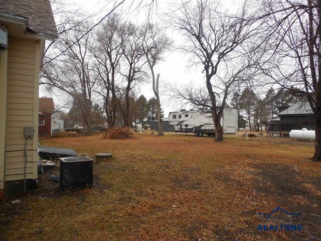 23508 Main St, Caputa, SD 57725 - view of yard with central AC unit and a residential view