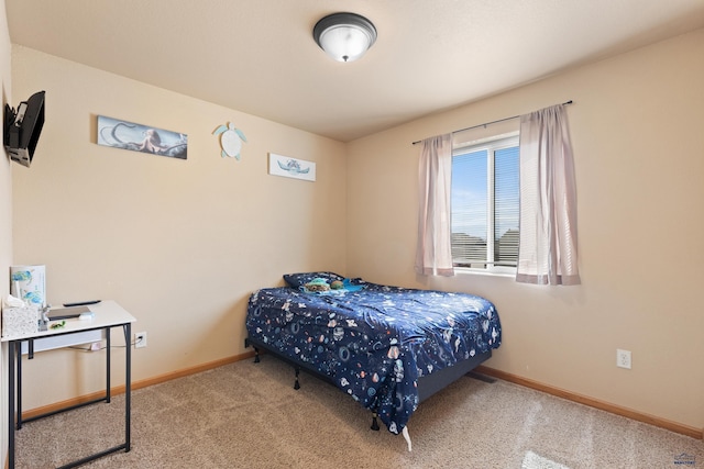 carpeted bedroom with baseboards