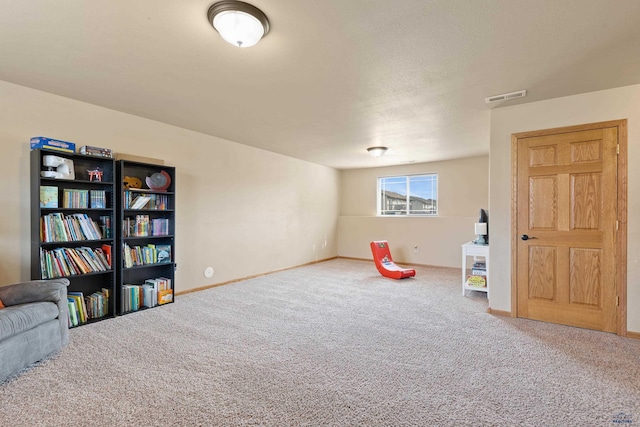 recreation room with carpet floors, baseboards, and visible vents