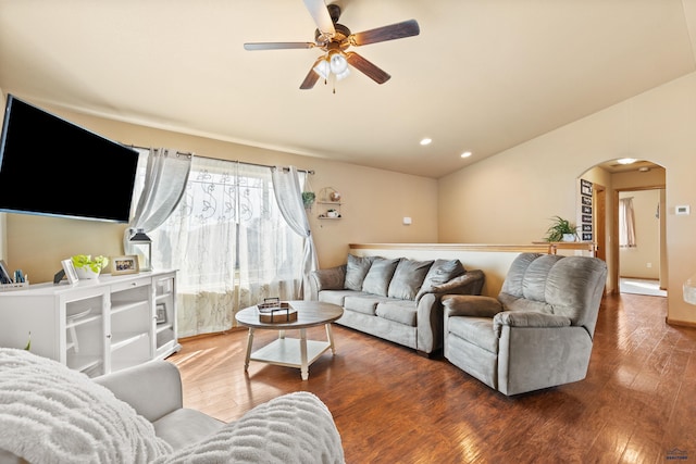 living area featuring recessed lighting, arched walkways, hardwood / wood-style flooring, and a ceiling fan