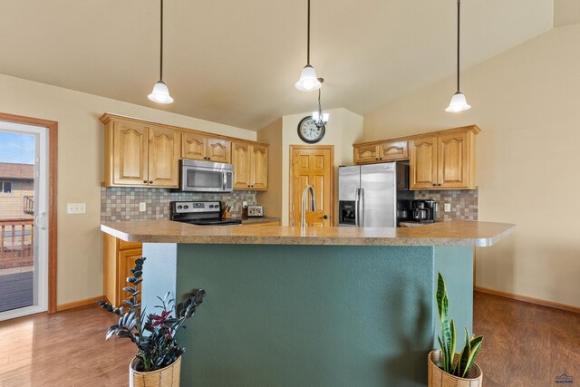 kitchen featuring light countertops, light wood-type flooring, and appliances with stainless steel finishes