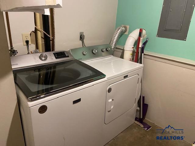 laundry area with independent washer and dryer, laundry area, and electric panel