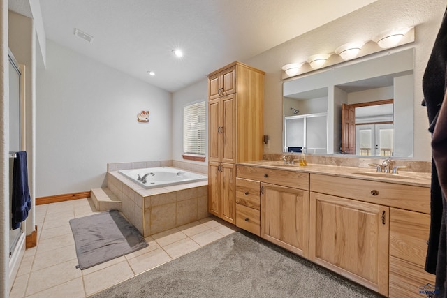 23863 Emerald Pines Dr, Hill City, SD 57745 - full bath featuring a stall shower, tile patterned flooring, and a sink