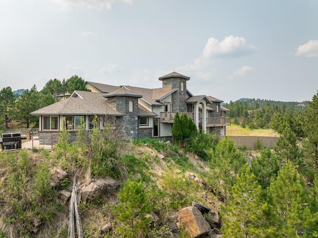 23863 Emerald Pines Dr, Hill City, SD 57745 - exterior space featuring stone siding and a shingled roof