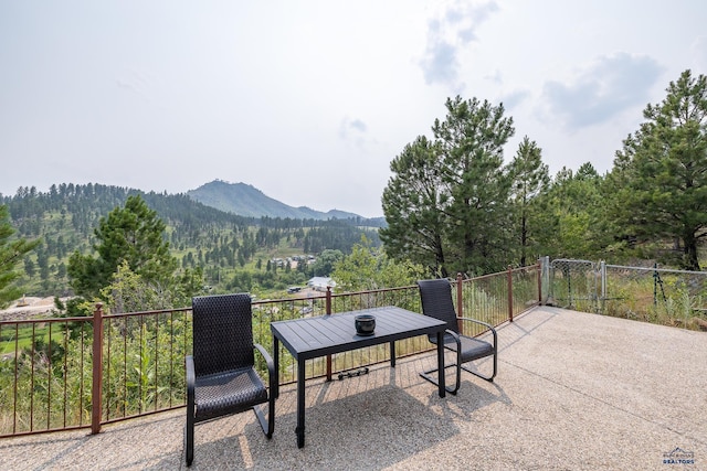 23863 Emerald Pines Dr, Hill City, SD 57745 - view of patio featuring a mountain view and a forest view