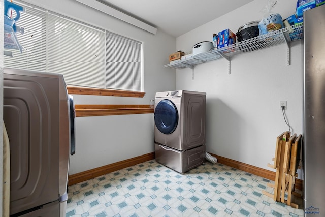 23863 Emerald Pines Dr, Hill City, SD 57745 - laundry room featuring baseboards, washer and clothes dryer, laundry area, and light floors