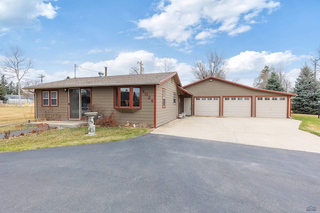 4024 W Main, Rapid City, SD 57702 - ranch-style home featuring an outbuilding, a garage, and concrete driveway