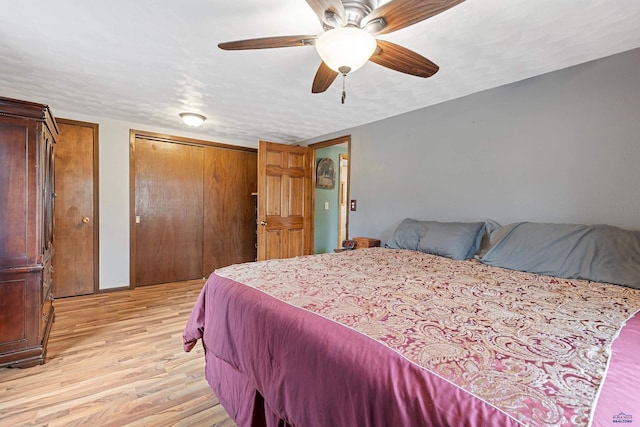 4024 W Main, Rapid City, SD 57702 - bedroom with baseboards, a textured ceiling, a ceiling fan, and light wood finished floors