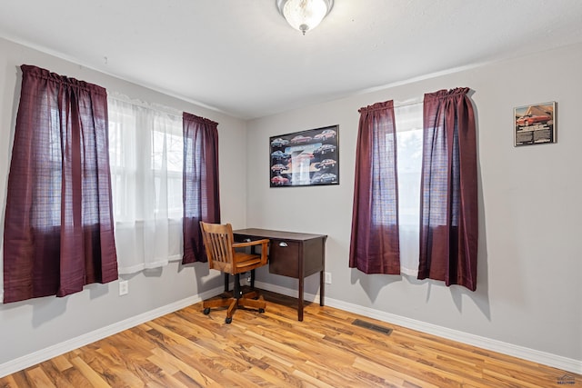 4024 W Main, Rapid City, SD 57702 - office space with baseboards, visible vents, and light wood-style floors