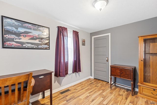 4024 W Main, Rapid City, SD 57702 - office area with baseboards, visible vents, and light wood-style flooring