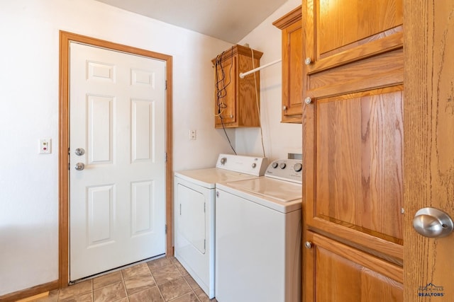 laundry area with cabinet space and separate washer and dryer