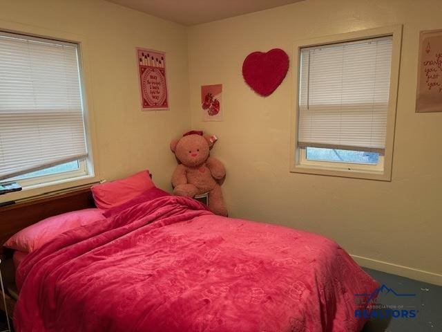 bedroom featuring baseboards