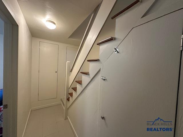 stairway with baseboards