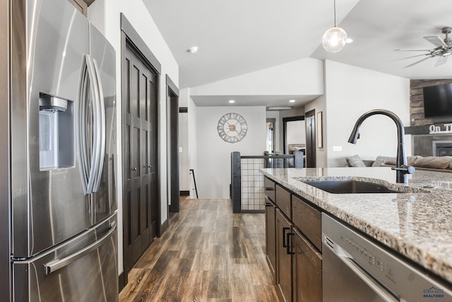21260 Ridgewood Trl, Lead, SD 57754 - kitchen with vaulted ceiling, a sink, dark wood finished floors, open floor plan, and stainless steel appliances