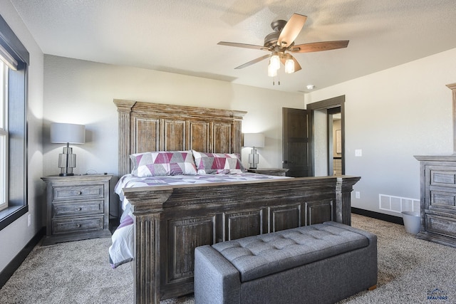 21260 Ridgewood Trl, Lead, SD 57754 - carpeted bedroom featuring baseboards, a textured ceiling, ceiling fan, and visible vents