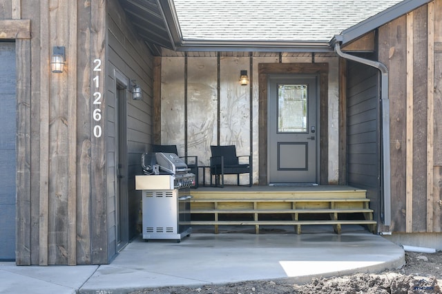 21260 Ridgewood Trl, Lead, SD 57754 - doorway to property featuring covered porch and roof with shingles