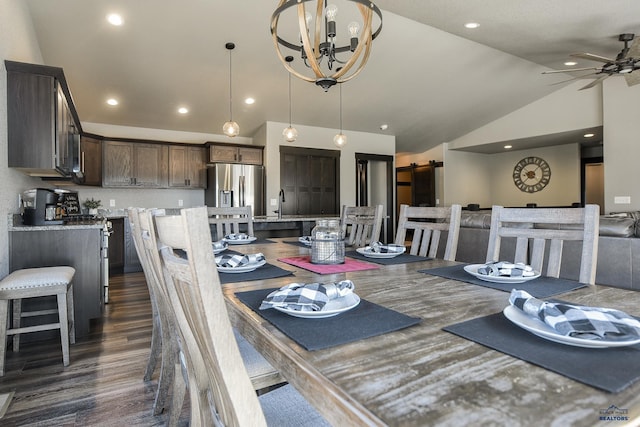21260 Ridgewood Trl, Lead, SD 57754 - dining area with recessed lighting, dark wood finished floors, a barn door, ceiling fan with notable chandelier, and vaulted ceiling