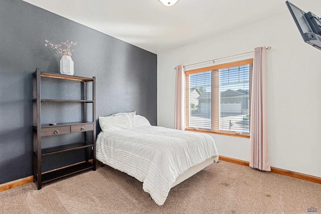 carpeted bedroom with baseboards