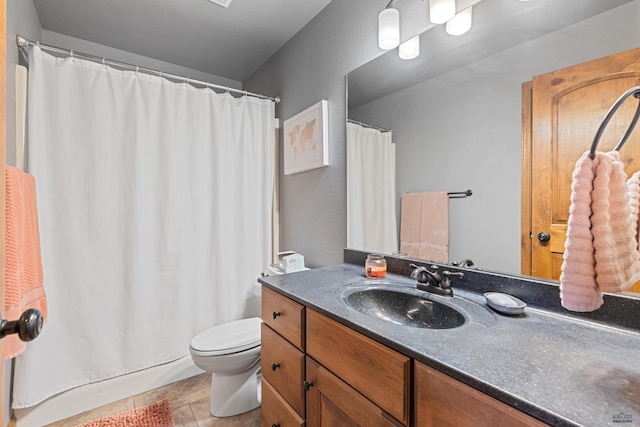 full bathroom featuring toilet, vanity, and a shower with curtain