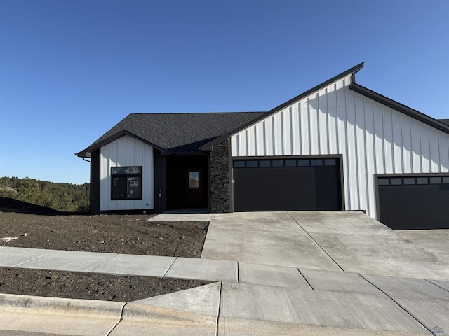 1230 Pinnacle Ct, Rapid City, SD 57701 - modern farmhouse with an attached garage, board and batten siding, and driveway