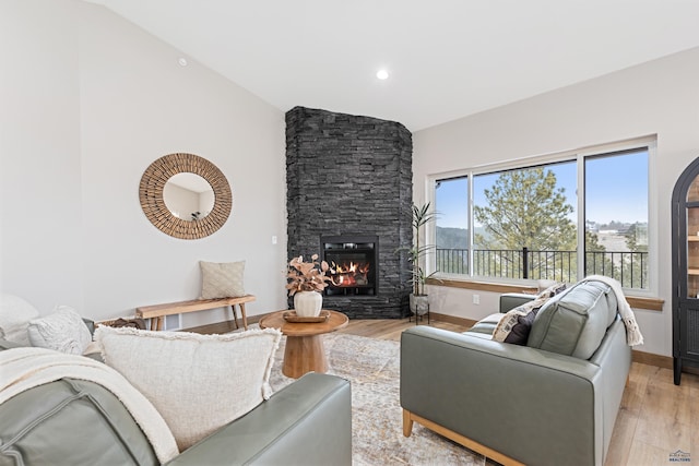 1230 Pinnacle Ct, Rapid City, SD 57701 - living room with light wood finished floors, a fireplace, lofted ceiling, recessed lighting, and baseboards
