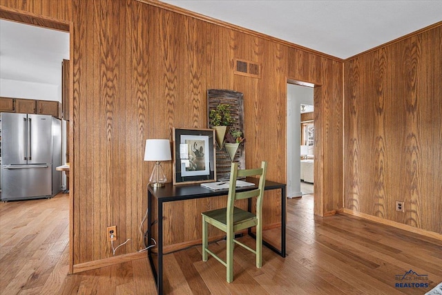 37 Washington St, Deadwood, SD 57732 - office space with light wood-type flooring, wood walls, and visible vents