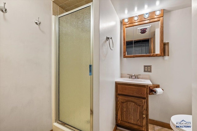 37 Washington St, Deadwood, SD 57732 - full bath featuring a stall shower, baseboards, toilet, and vanity
