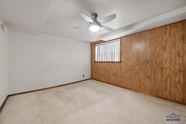 37 Washington St, Deadwood, SD 57732 - carpeted empty room featuring baseboards, a ceiling fan, and wooden walls