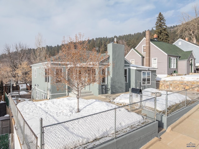 37 Washington St, Deadwood, SD 57732 - view of front of property featuring a fenced front yard and a gate