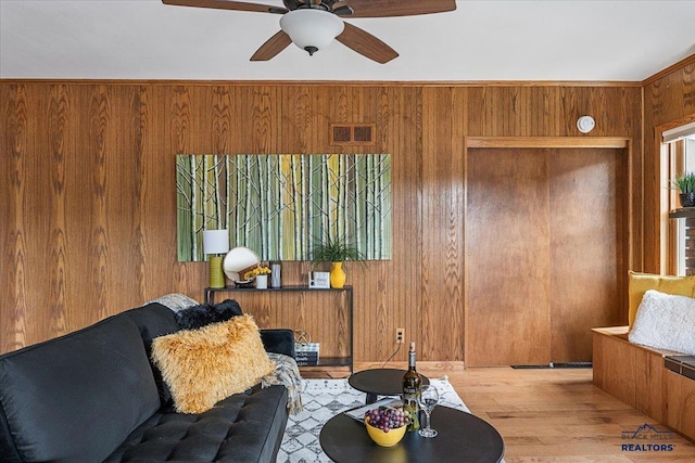 37 Washington St, Deadwood, SD 57732 - living area featuring wood walls, visible vents, a ceiling fan, and wood finished floors