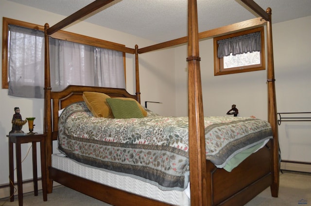 1521 Forest Ct, Rapid City, SD 57701 - carpeted bedroom with a baseboard radiator and a textured ceiling