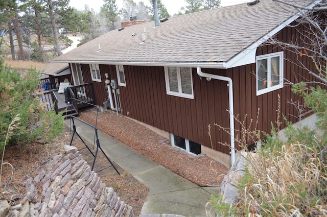 1521 Forest Ct, Rapid City, SD 57701 - view of property exterior featuring roof with shingles and a chimney