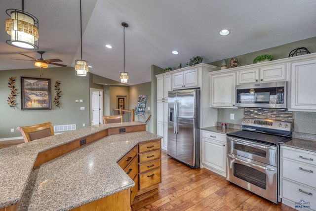 4153 Augusta Dr, Rapid City, SD 57703 - kitchen with white cabinets, stainless steel appliances, light wood-style floors, and ceiling fan