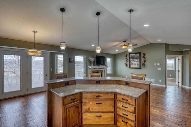 4153 Augusta Dr, Rapid City, SD 57703 - kitchen with vaulted ceiling, a ceiling fan, a fireplace, dark wood-style floors, and open floor plan