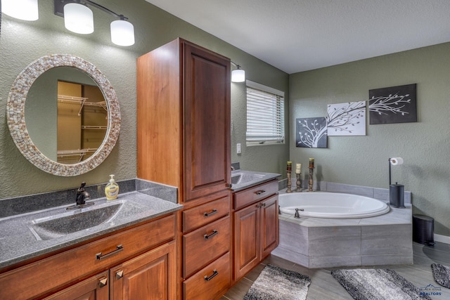 4153 Augusta Dr, Rapid City, SD 57703 - full bath featuring a bath, vanity, a textured wall, and a textured ceiling