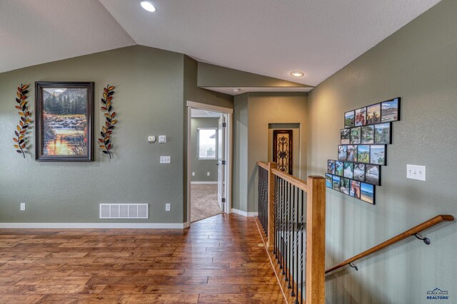 4153 Augusta Dr, Rapid City, SD 57703 - hall featuring visible vents, wood finished floors, an upstairs landing, and lofted ceiling